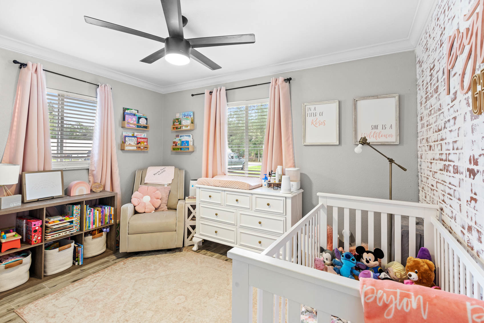 bedroom with nursery furniture and pink decor